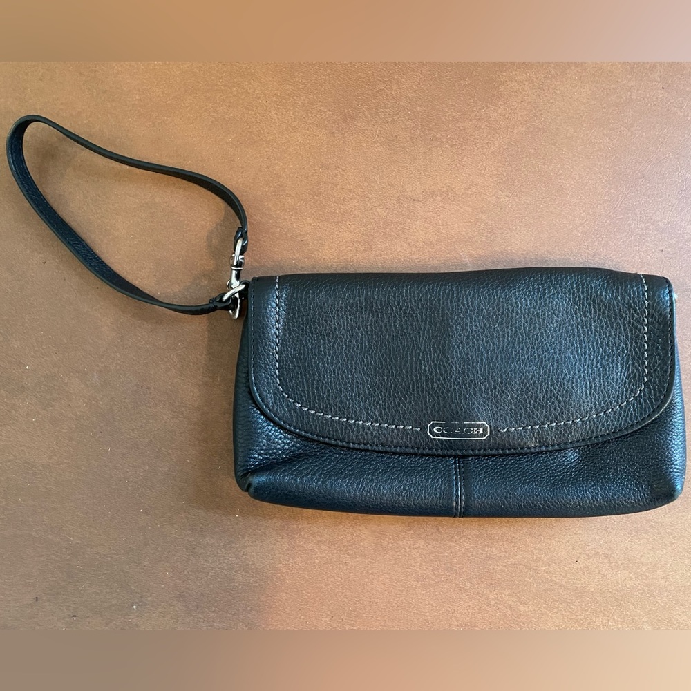 Coach wristlet wallet in black leather and beautiful teal lining. Snap close